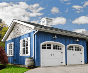 A blue garage with two doors
