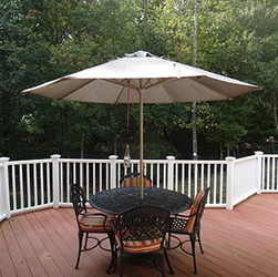 A deck with a table and chairs. Consider how you will use your deck when you plan it