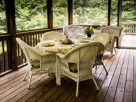Tables and Chairs on a Screened Porch
